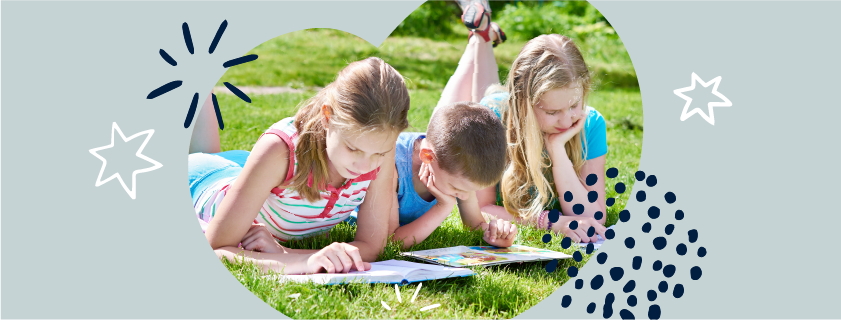 image of children in a park, reading
