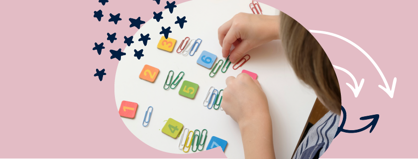 Image of child counting with coloured paperclips