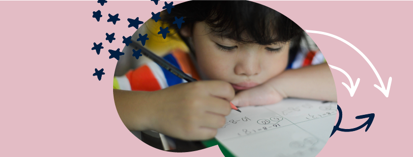 Image showing a child writing in a notebook